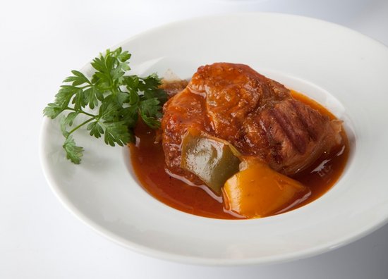 Veal recipe BBQ ossobuco recipe with sweet onion, green pepper, carrot and thyme.