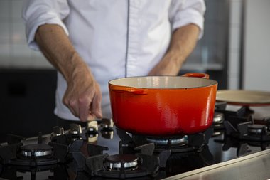 Place the pan on the flame and allow it to get hot.