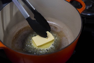 Spread the butter and allow it to bubble.
