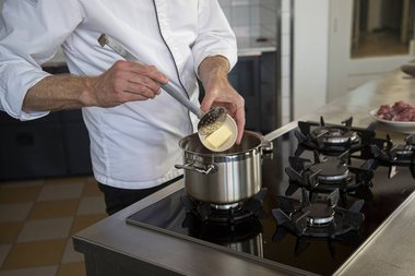 Put the butter in the pan.