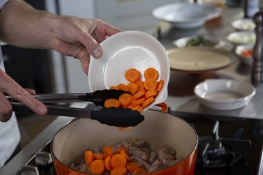 Add vegetables and herbs to the pan.