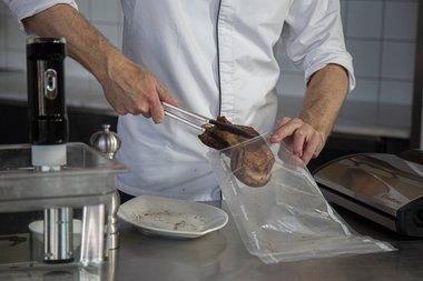 Place the veal in a vacuum bag.