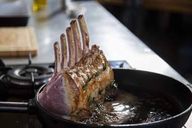 Fry the frenched veal rack. 