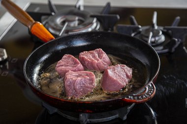 Place the veal tenderloin in the pan.