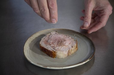 Season the veal ribeye with herbs.