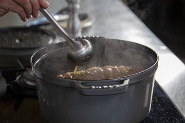 Sieve the braising liquid as a basis for the gravy.