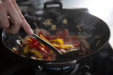 Add the vegetables and stir fry with the veal.